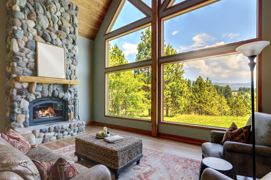 living room picture windows with stone fireplace