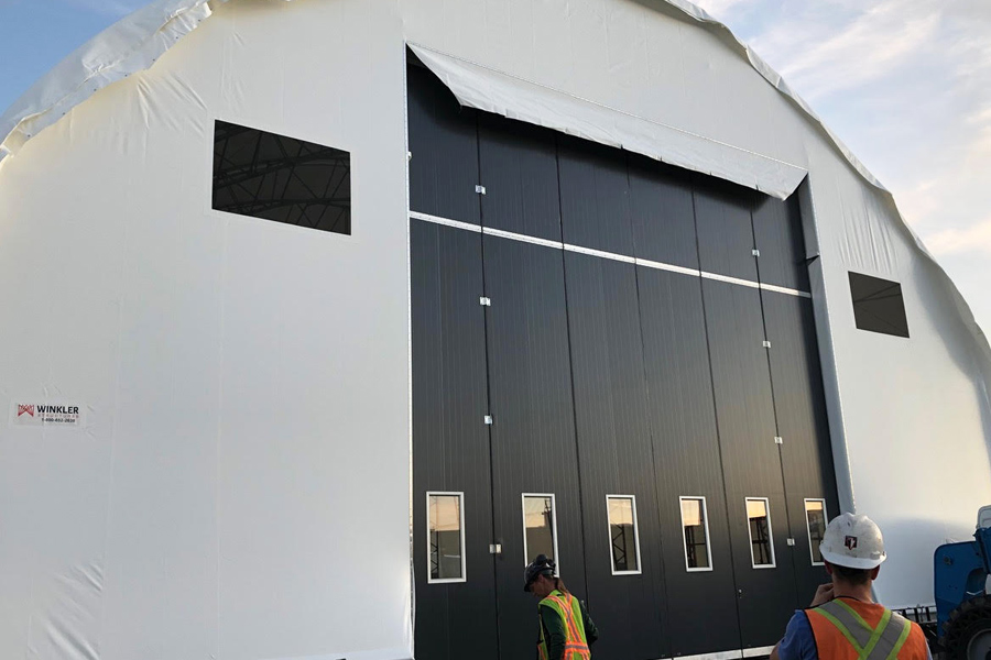 Black 6 paneled industrial FinDoor, exterior